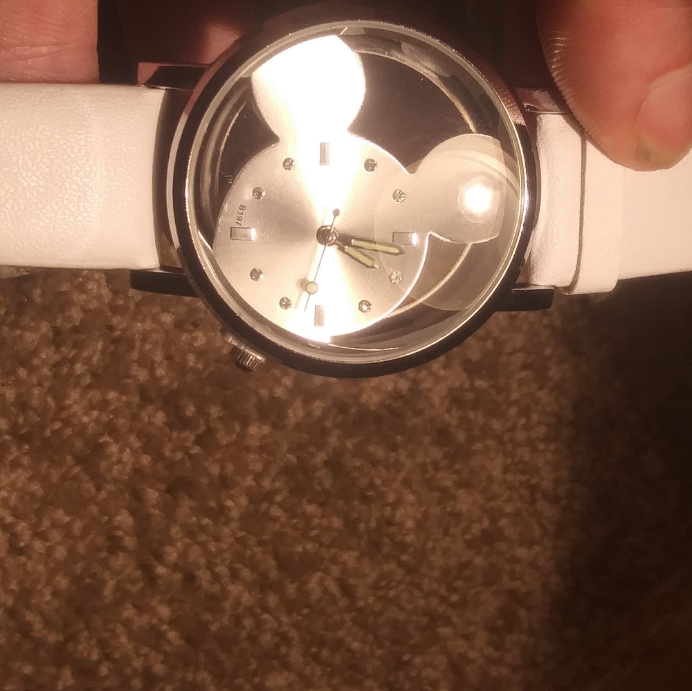 Watch. White band silver face